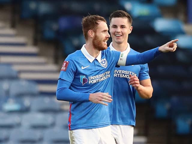 Tom Naylor points at colleague and house-mate Andy Cannon after scoring against King's Lynn on Saturday. Picture: Naomi Baker/Getty Images