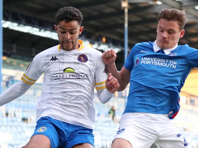 Ross Barrows of King's Lynn Town battles for possession with Cameron Pring of Pompey. Picture: Naomi Baker/Getty Images