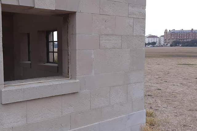 A window which has had its frame ripped out at the naval memorial.