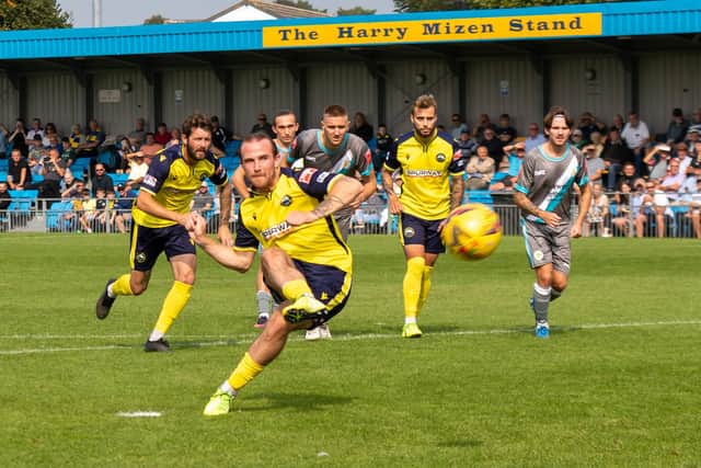 Theo Widdrington, pictured scoring a penalty for Gosport in September, has joined King's Lynn Town on loan. Picture: Mike Cooter