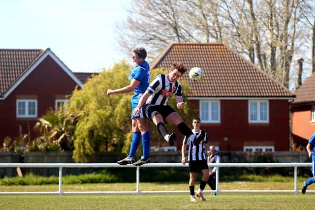 Fleetlands' Sam Adams, left, and Liam Buxton of Hayling United. Picture: Tom Phillips.