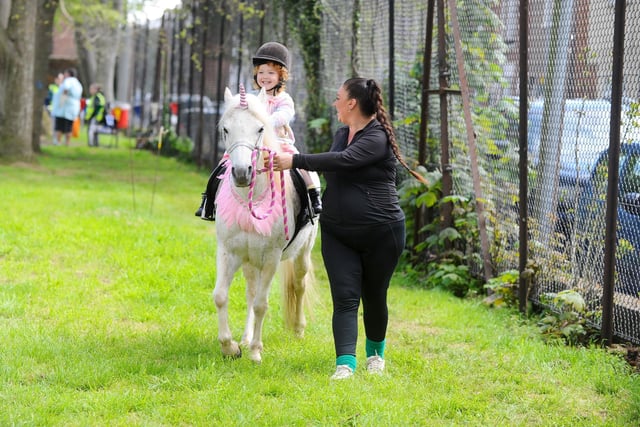 Aria Hart, 3, from Portsmouth enjoying a pony ride at the fete.
Picture: Sarah Standing