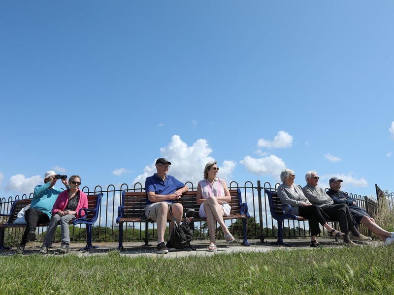 A bench with a view - people find a comfy spot to watch the action.Picture: Chris  Moorhouse (270724-25)