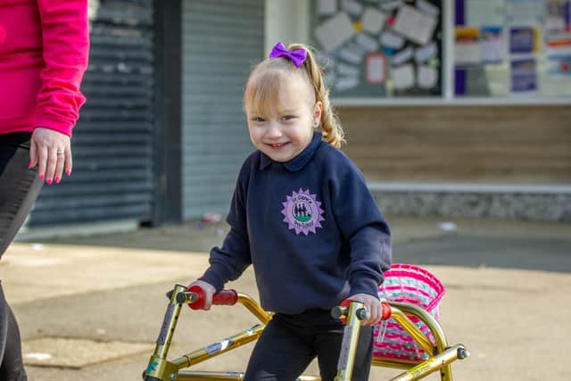 Priya Pattinson, 3, at the front of her school.
Picture: Habibur Rahman