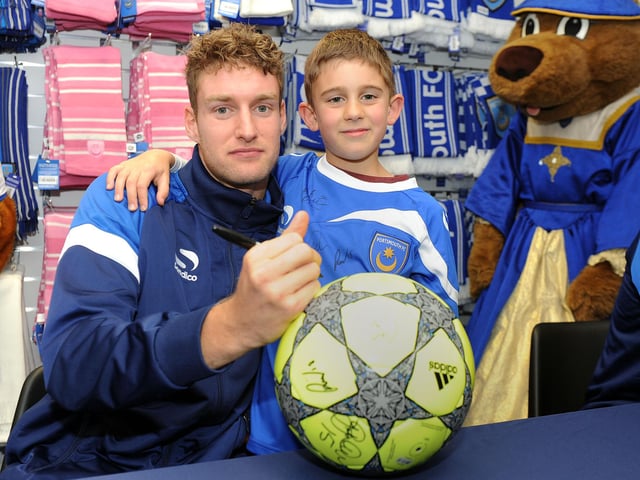 Ryan Bird signs this young fan's football at a meet and greet at the Pompet megastore in 2013