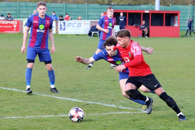 Fareham striker Josh Benfield (red) on the attack. Picture by Ken Walker