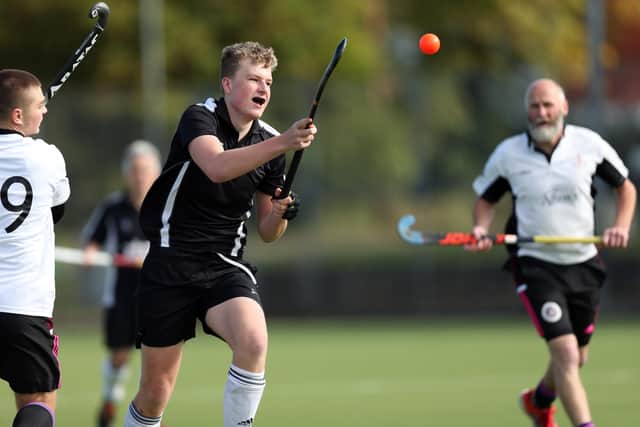 Fareham 4ths' Ben Randell, centre, v Portsmouth 2nds. Picture: Chris Moorhouse