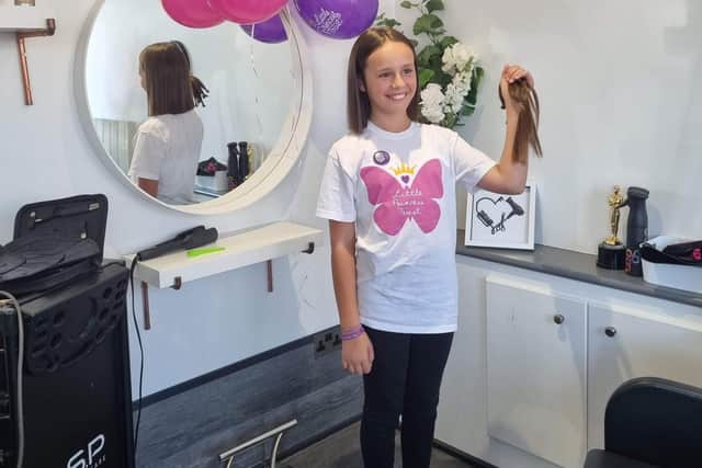 10-year-old Cacey Gawn at The Hair Lounge, in Cosham, after chopping off her hair and raising over £700 for the Little Princess Trust.