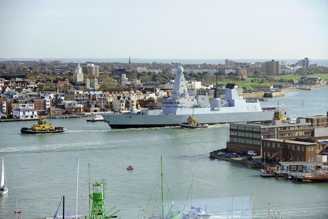 30th October 2012. HMS Dauntless arrives back in Portsmouth to a typically warm welcome from those on the shore-line and families on the quayside 
Picture: Malcolm Wells (123530-1024)
