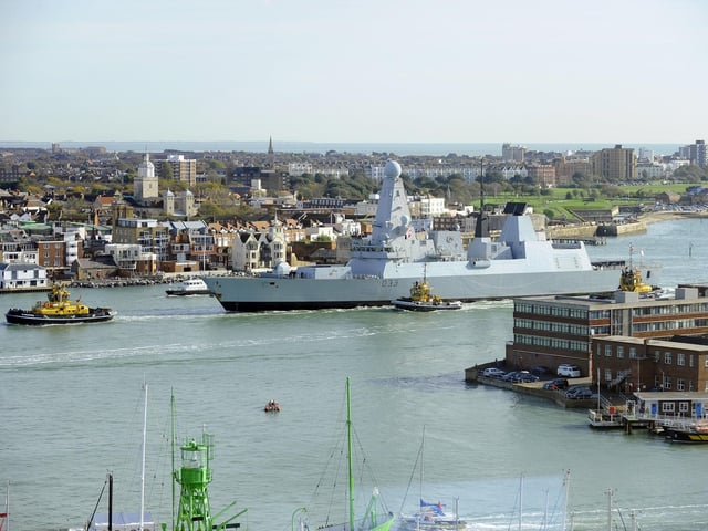 30th October 2012. HMS Dauntless arrives back in Portsmouth to a typically warm welcome from those on the shore-line and families on the quayside
Picture: Malcolm Wells (123530-1024)