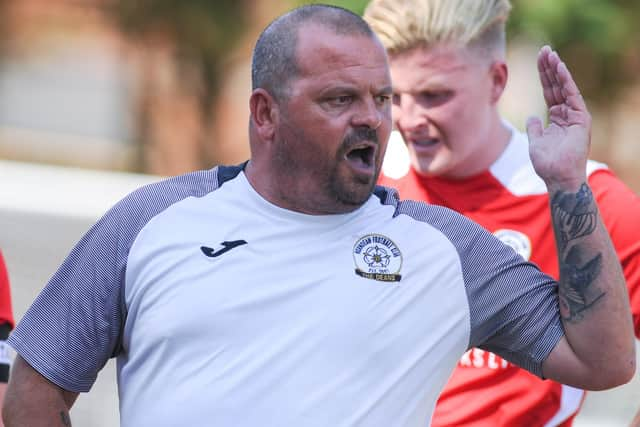 Horndean boss Michael Birmingham gives instructions to his players during a drinks break. Picture by Martyn White