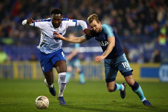 Manny Monthe battles with England captain Harry Kane. Photo by Clive Brunskill/Getty Images