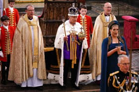 Lord President of the Council, Penny Mordaunt, holding the Sword of State walking ahead of King Charles III during his coronation ceremony in Westminster Abbey, London.