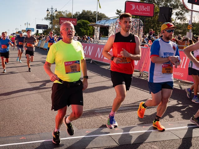 Pictured is: Runners cross the line to finishPicture: Keith Woodland (151021-751)