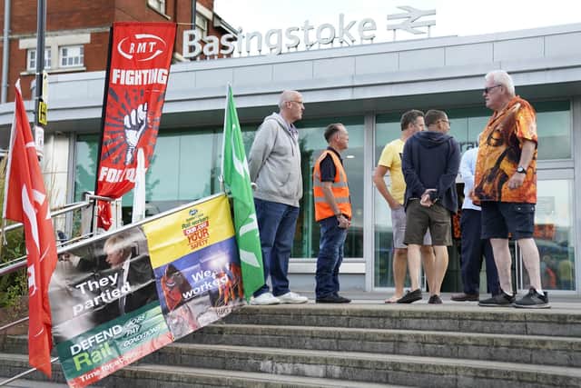 Members of the Rail, Maritime and Transport union (RMT) on the picket line outside Basingstoke train station Picture: Andrew Matthews/PA Wire