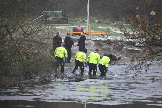 Police search teams at the scene in Babbs Mill Park in Kingshurst, Solihull