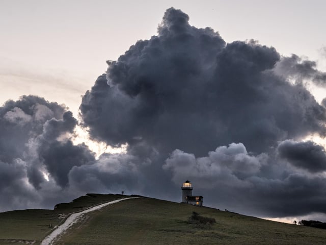 Belle Tout lighthouse under a storm cloud. Picture by Gavin Parrott