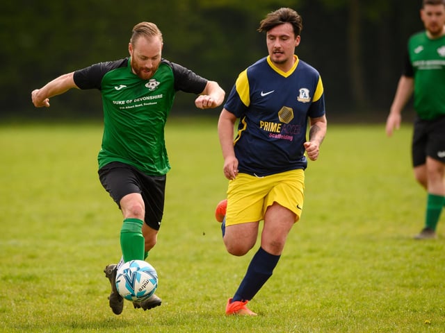 Action from Saturn Royale's 1-0 win over Pelham Arms (blue and yellow kit) in the second Adelaide Cup semi-final. Picture: Keith Woodland (300421-839)