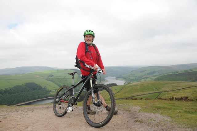 Rangers took to mountain bikes to patrol the Peak District National Park. Pennine Way ranger Martin Sharp at the top of Whinstone Lee Tor overlooking Ladybower Reservoir in 2013