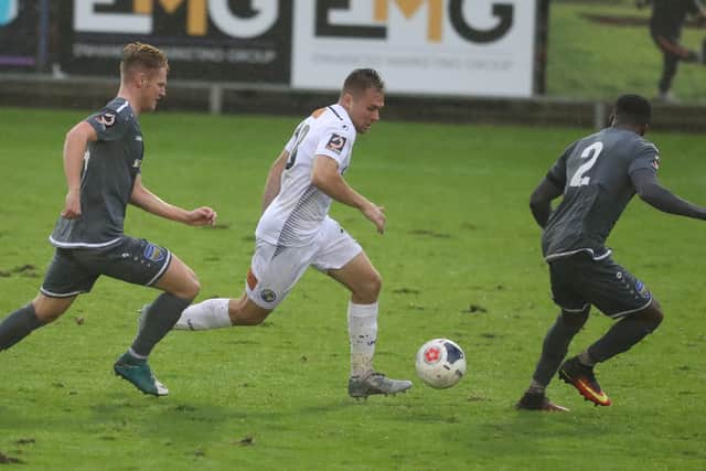 Ryan Seager (middle), in action for Hawks last season, scored his eighth NL South goal of the season for Hungerford - but Dartford hit back to win and reclaim top spot from Dorking. Pic: Dave Haines.