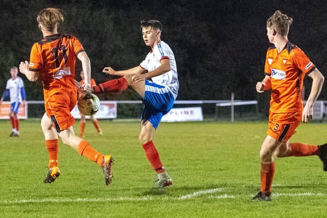 Christian Bennett challenges for possession during Gosport Borough under-23s' game at AFC Portchester in October. Picture: Colin Farmery.