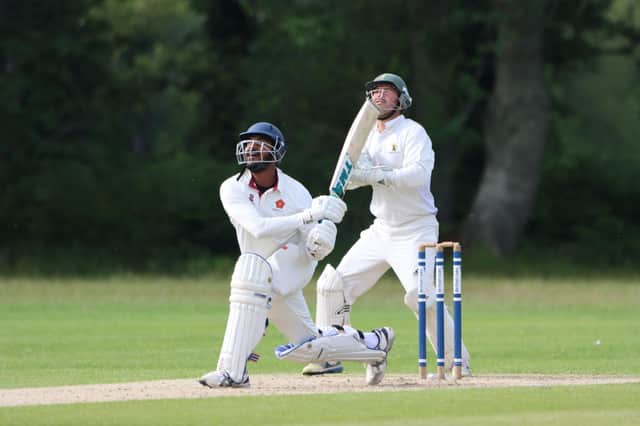 Havant batsman Richard Jerry skies a shot against Bournemouth. Picture: James Robinson