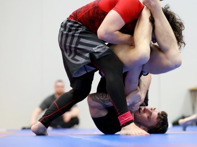 David Ionita, top, competing in a Brazilian Jiu Jitsu competition at the Ravelin Centre in Portsmouth. Picture: Chris Moorhouse (jpns 250223-08)
