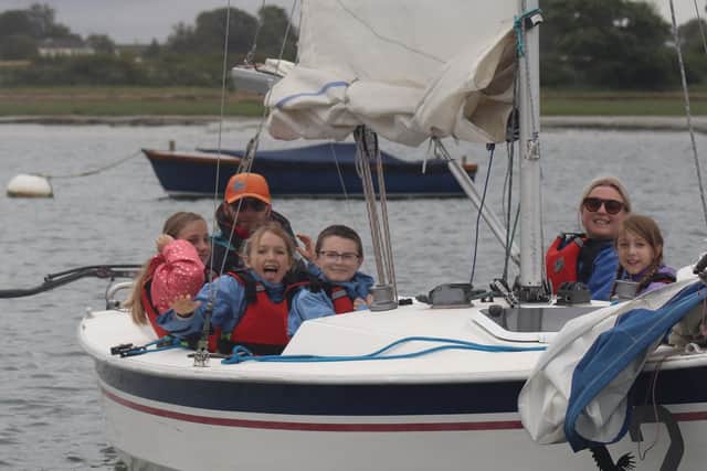 Young Helms participants enjoying their sailing adventure in Chichester Harbour. The programme, funded by the Fat Face Foundation, offers hands-on sailing experiences that build confidence, skills and a love for the water.