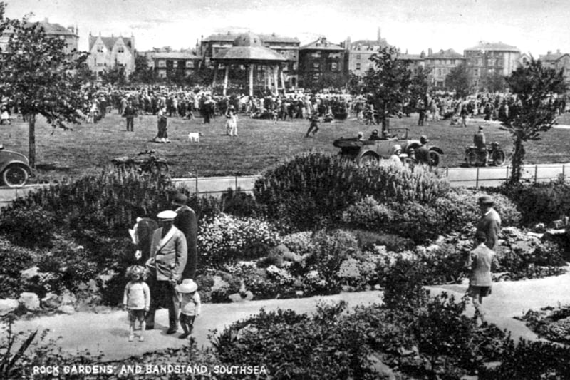 The bandstand was located between Ladies’ Mile and Clarence Esplanade.  This lively scene shows it looking north across Southsea Common with Clarence Parade in the background.  The postcard is undated but judging by the clothes and cars on Clarence Esplanade, it is probably the early 1930's.