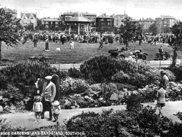 The bandstand was located between Ladies’ Mile and Clarence Esplanade. This lively scene shows it looking north across Southsea Common with Clarence Parade in the background. The postcard is undated but judging by the clothes and cars on Clarence Esplanade, it is probably the early 1930's.