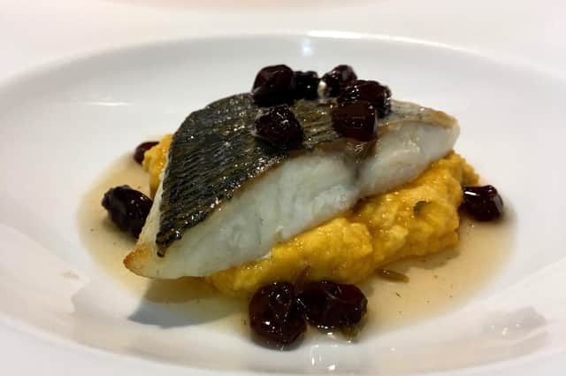 Seasonal butternut squash hummus served with pan-fried bream and pickled raisins.