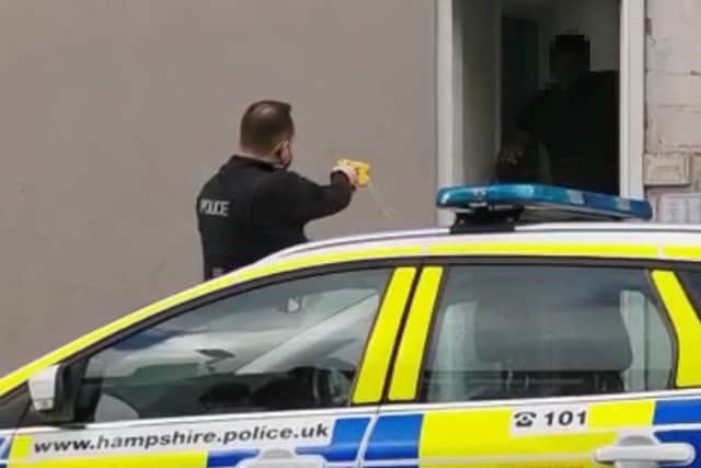 A police officer was recorded firing a Taser at a man in North End. Captured is the moment the Taser hits the male.