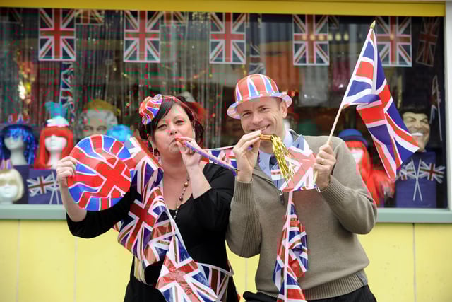 U-Need-Us staff (l-r) Tracey Knipe and Steve Searle help get the street party started outside the store in February 2011. Picture: Allan Hutchings (110573-233)