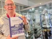 Alan Knight with the 125 history being sold to raise funds for ‘Pompey Family’ charities.