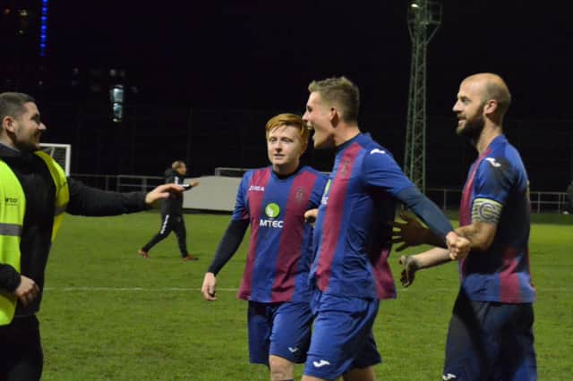 Harry Bedford, left, greets (from left) Frankie Paige, Tom Cain and Tom Jeffes at the end of US Portsmouth's FA Vase win against Millbrook. Picture: Daniel Haswell.