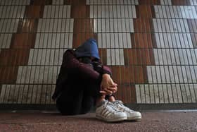 PICTURE POSED BY MODEL of a teenage girl showing signs of mental health issues. Picture: Gareth Fuller/PA Wire