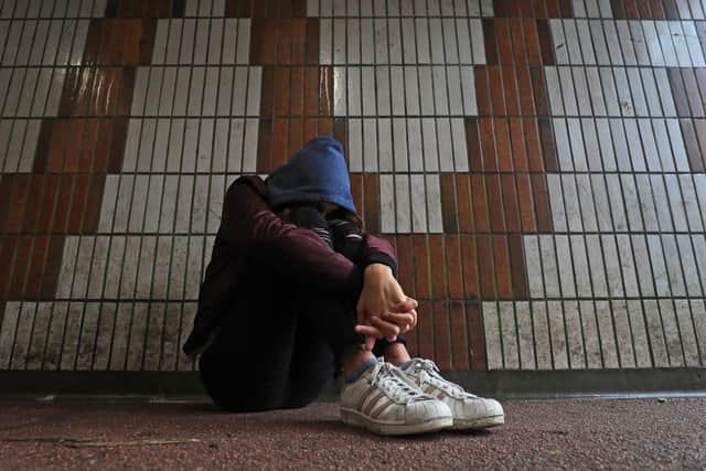 PICTURE POSED BY MODEL of a teenage girl showing signs of mental health issues. Picture: Gareth Fuller/PA Wire