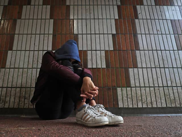 PICTURE POSED BY MODEL of a teenage girl showing signs of mental health issues. Picture: Gareth Fuller/PA Wire