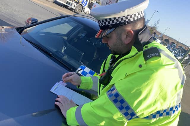 Police on a mobile phone operation in Fareham on March 16 2020. Several drivers were handed fixed penalty notices of £200 with six points on their licences. Picture: Ben Fishwick
