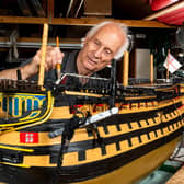 Michael Byard with the model of HMS Victory Picture: Jordan Pettitt/Solent News & Photo Agency