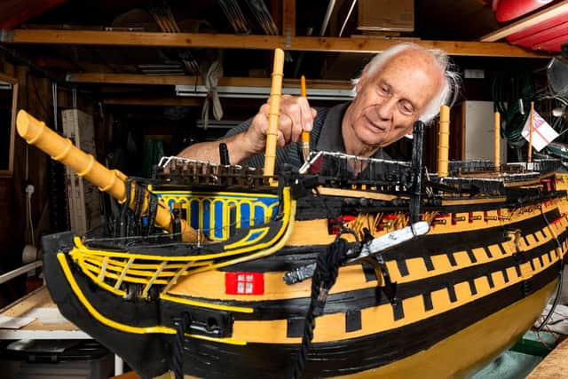 Michael Byard with the model of HMS Victory Picture: Jordan Pettitt/Solent News & Photo Agency