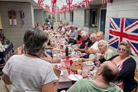Residents from the retirement flats get together for a street party