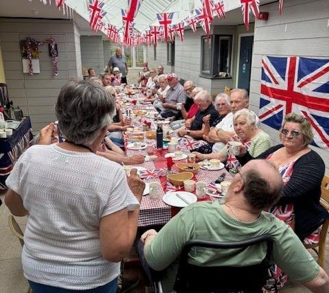 Residents from the retirement flats get together for a street party