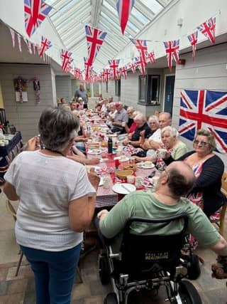 Residents from the retirement flats get together for a street party