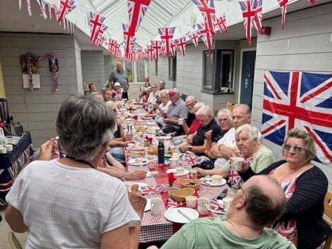 Residents from the retirement flats get together for a street party