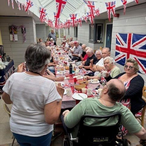 Residents from the retirement flats get together for a street party