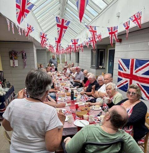 Residents from the retirement flats get together for a street party