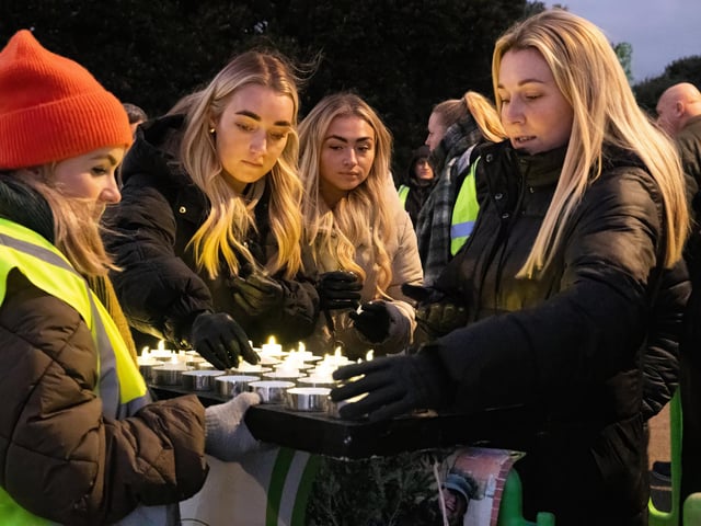 Families and friends came together to light a candle to remember a loved one this Christmas Photos by Alex Shute