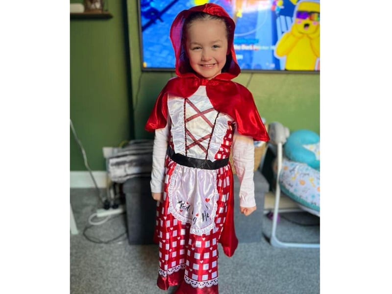 This Little Red Riding Hood looks extremely happy to be celebrating World Book Day.