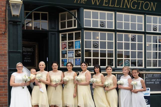 Catherine with bridesmaids outside The Wellington, Old Portsmouth.
Left to right: Catherine Inguanez, Anna McCarthy holding baby Hugo McCarthy, Paula Amey, Jessica Amey, Lauren Amey, Jodie Withers, Rhiannon Amey, Fallon Jeffery and Brooke Lewis.
Picture: Weddings by Sophia B/ www.besidetheseasidephotography.co.uk